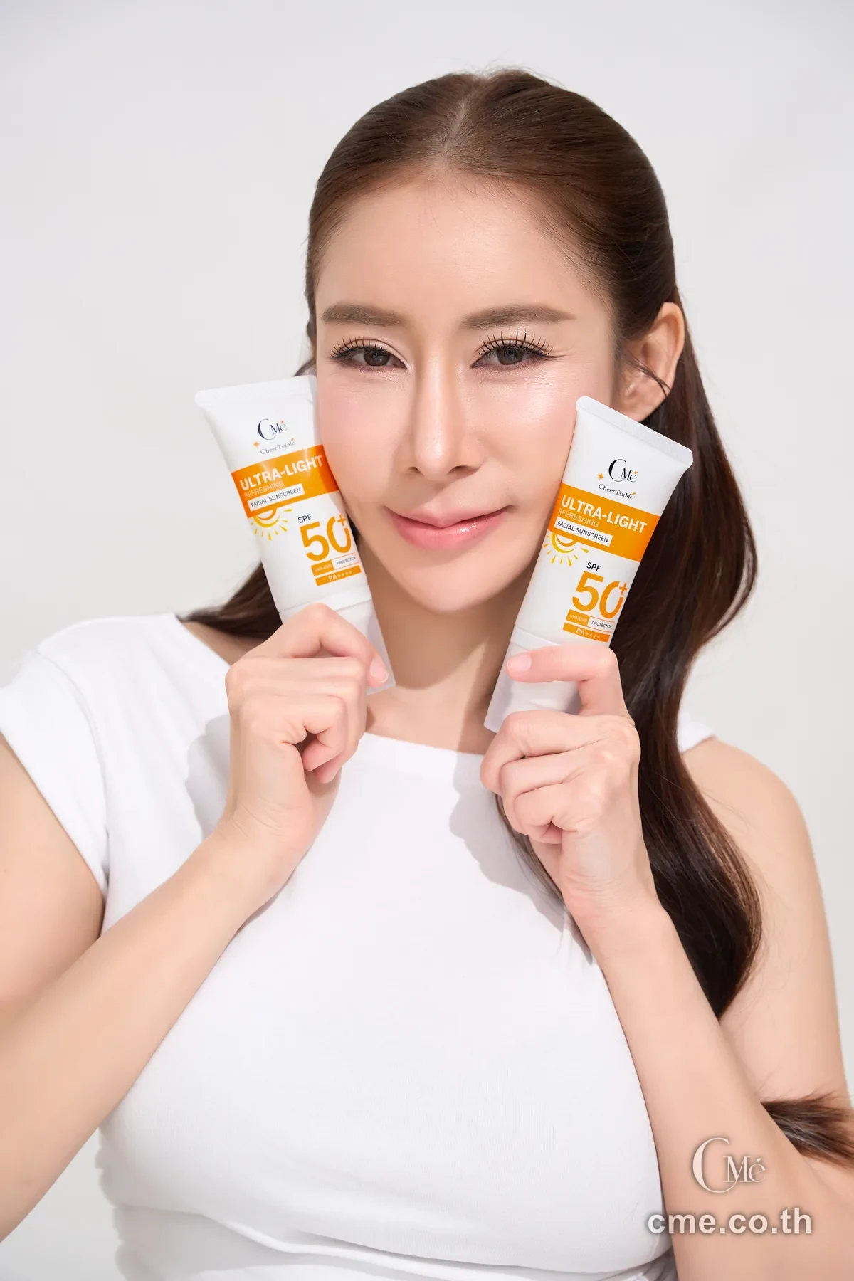 CMe Sunscreen — model with even, beautiful skin showing the sheer fluid texture